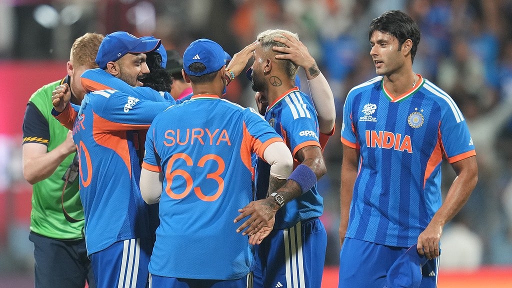 Indian players celebrate after their win in the T20 World Cup cricket semi-final match against England in Mumbai, India, Thursday, March 5, 2026. - AP Photo/Rafiq Maqbool