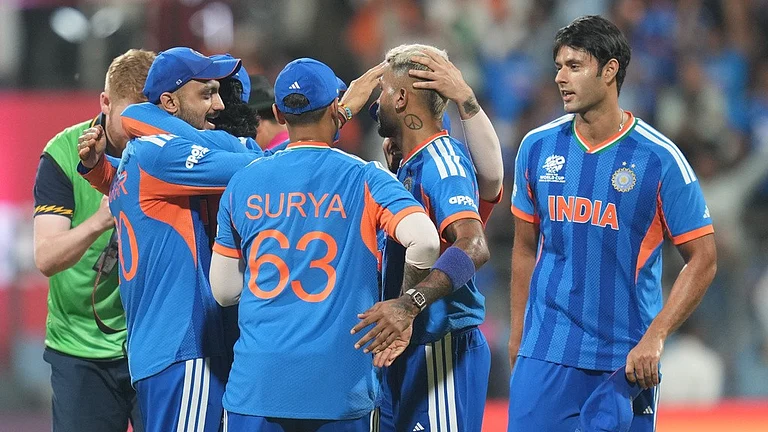 Indian players celebrate after their win in the T20 World Cup cricket semi-final match against England in Mumbai, India, Thursday, March 5, 2026. - AP Photo/Rafiq Maqbool