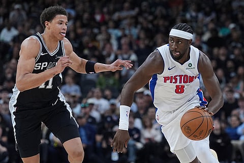 Detroit Pistons guard Caris LeVert (8) drives against San Antonio Spurs forward Carter Bryant (11) during the first half of an NBA basketball game in San Antonio.