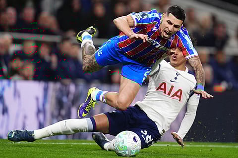 Crystal Palace's Daniel Munoz, left, and Tottenham Hotspur's Souza in action during the English Premier League soccer match between Tottenham Hotspur and Crystal Palace in London.
