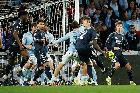 Real Madrid's Antonio Rudiger tries a shot during a Spanish La Liga soccer match between Celta Vigo and Real Madrid in Vigo, Spain.