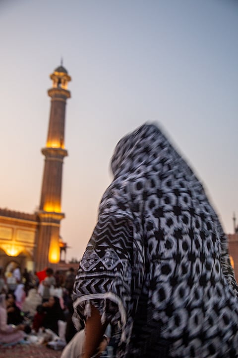 A woman prays at Jama Masjid in Old Delhi after breaking her fast during Ramadan.