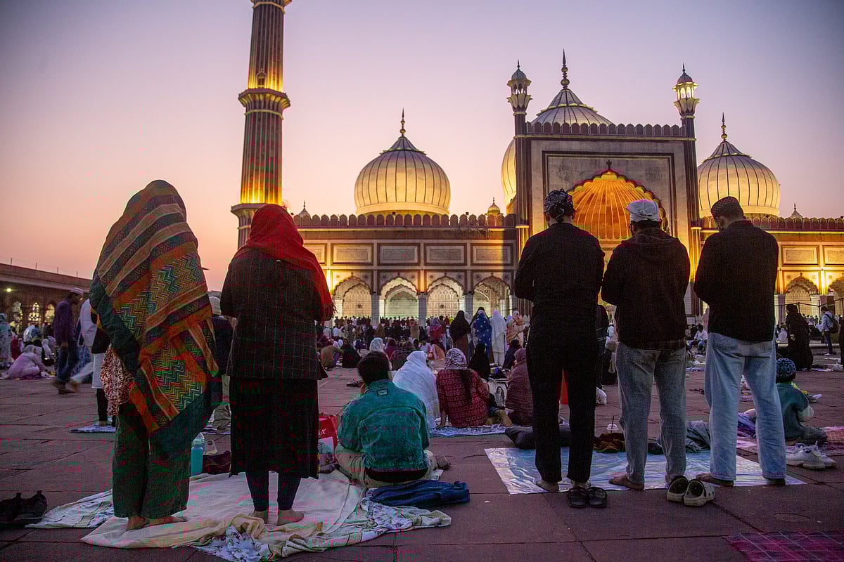 During Ramadan, men and women offer prayers at Jama Masjid in Old Delhi. 