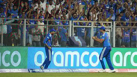 India's Axar Patel, left, and Shivam Dube celebrate the dismissal of England's Will Jacks during the T20 World Cup cricket semi-final match between India and England in Mumbai, India, Thursday, March 5, 2026.