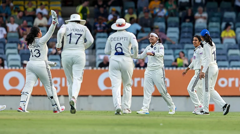 India's Sayali Satghare celebrates a wicket during the one-off Test against Australia on March 7, 2026. - | Photo: X/BCCIWomen