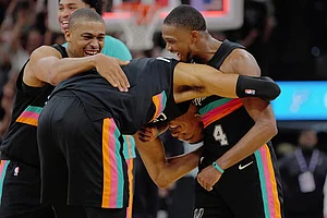 | Photo: AP/Darren Abate : San Antonio Spurs players Victor Wembanyama, center, De'Aaron Fox (4) and Keldon Johnson celebrate their win after an NBA basketball game against the Los Angeles Clippers in San Antonio.