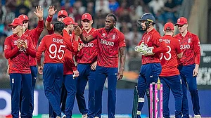 PTI : England's Adil Rashid celebrates with teammates the wicket of West Indies' Roston Chase during ICC T20 World Cup 2026 at the Wankhede Stadium.