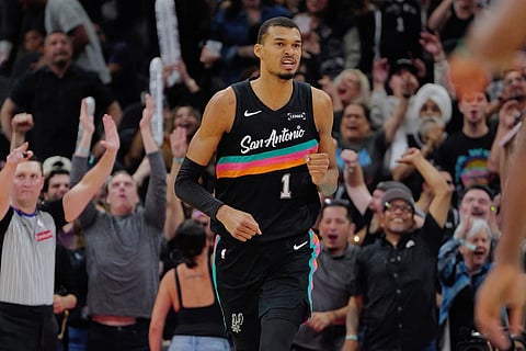 San Antonio Spurs center Victor Wembanyama celebrates a basket during the second half of an NBA basketball game against the Los Angeles Clippers in San Antonio.
