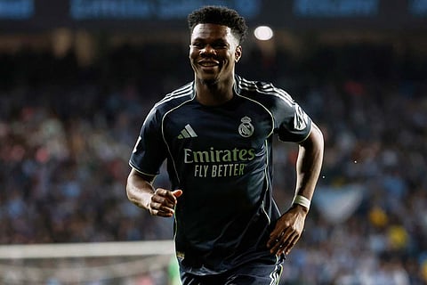Real Madrid's Aurelien Tchouameni celebrates after scoring the opening goal during a Spanish La Liga soccer match between Celta Vigo and Real Madrid in Vigo, Spain.