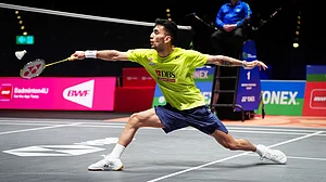 David Davies/PA via AP : India's Lakshya Sen plays a shot against China's Li Shi Feng during a men's singles quarterfinals match on day fourof the All England Open Badminton Championships in Birmingham.