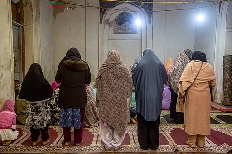 Women offer Maghrib prayer inside the women’s prayer hall at Nizamuddin Dargah.