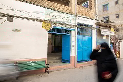  A woman crosses the Shaheen Masjid in Jasola Vihar. The mosque allows entry only for male worshippers.