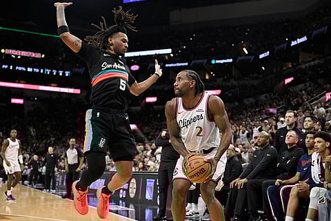Los Angeles Clippers forward Kawhi Leonard (2) looks to shoot as he is guarded by San Antonio Spurs guard Stephon Castle during the second half of an NBA basketball game in San Antonio.