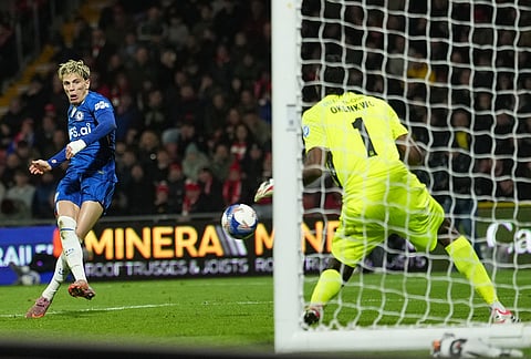 Chelsea's Alejandro Garnacho scores during the fifth round FA Cup soccer match between Wrexham and Chelsea in Wrexham, Wales.