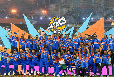 India's captain Suryakumar Yadav lifts the tournament trophy with teammates after winning the ICC Men's T20 World Cup 2026, at Narendra Modi Stadium, in Ahmedabad, Gujarat.
