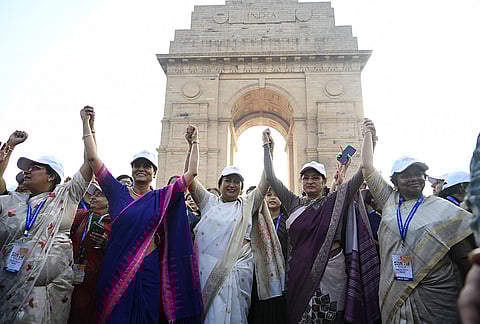 Delhi Chief Minister Rekha Gupta, centre, and others, during a 'Shakti Walk' organised by the Ministry of Women and Child Development on the occasion of International Women's Day, at Kartavya Path in New Delhi.