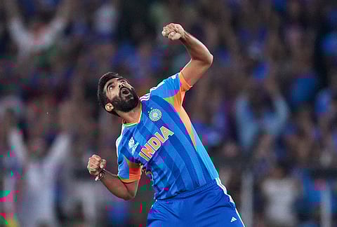 India's Jasprit Bumrah celebrates the wicket of New Zealand's Matt Henry during the T20 World Cup cricket final match between India and New Zealand in Ahmedabad.