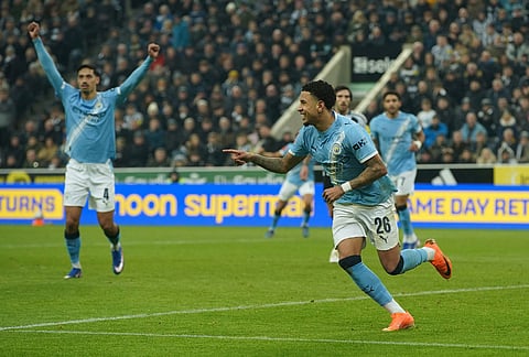 Manchester City's Savinho celebrate after a goal during the fifth round FA Cup soccer match between Newcastle and Manchester City in Newcastle, England.