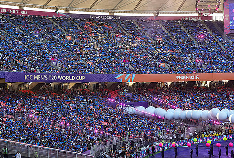 Spectators gather in the stands as artistes perform before the ICC Men's T20 World Cup 2026 final cricket match between India and New Zealand, at Narendra Modi Stadium, in Ahmedabad, Gujarat.