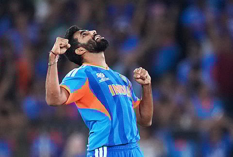 India's Jasprit Bumrah celebrates the wicket of New Zealand's Matt Henry during the T20 World Cup cricket final match between India and New Zealand in Ahmedabad.