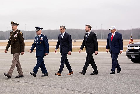 US President Donald Trump with Vice President JD Vance as they arrive to honour six American service members whose remains were returned to their families at Dover Air Force Base, in the United States. 