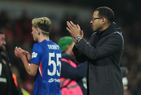Chelsea's head coach Liam Rosenior walks off the pitch after the fifth round FA Cup soccer match between Wrexham and Chelsea in Wrexham, Wales.
