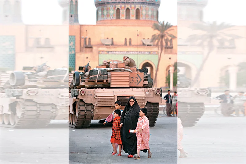 A US military tank next to a mosque in Baghdad in 2003