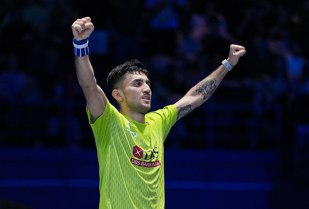 India's Lakshya Sen celebrates after winning the men's singles semifinal match against Canada's Victor Lai at the All England Open Badminton Championships in Birmingham, England. - | Photo: AP/Kin Cheung