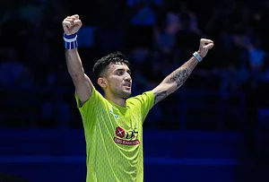 | Photo: AP/Kin Cheung : India's Lakshya Sen celebrates after winning the men's singles semifinal match against Canada's Victor Lai at the All England Open Badminton Championships in Birmingham, England.