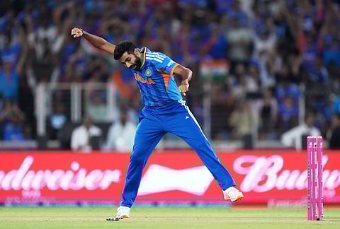 India's Jasprit Bumrah celebrates the wicket of New Zealand's James Neesham during the T20 World Cup cricket final match between India and New Zealand in Ahmedabad.
