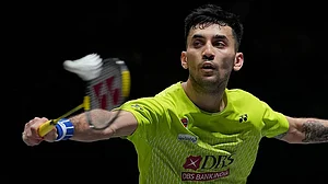 Photo: AP : India's Lakshya Sen plays against Canada's Victor Lai during the men's singles semifinal match at the All England Open Badminton Championships in Birmingham, England.