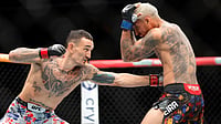 UFC 326: Charles Oliveira Takes BMF Title From Max Holloway Nearly 11 Years After First Meeting Steve Marcus/Las Vegas Sun via AP : Max Holloway, left, punches Charles Oliveira in a lightweight fight during UFC 326 Saturday, March 7, 2026, in Las Vegas. (Steve Marcus