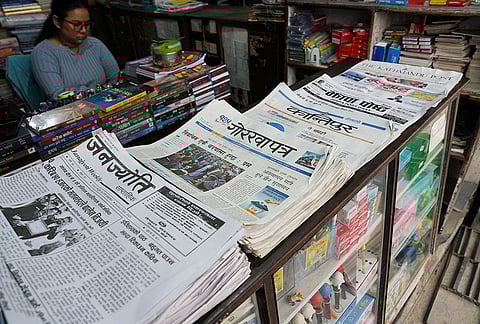 Newspapers are displayed at a store carrying reports on the landslide victory of Balendra Shah in general elections, in Damak, Jhapa, Nepal. Shah defeated four-time former prime minister K P Sharma Oli by a margin of about 50,000 votes in the Jhapa-5 constituency. 