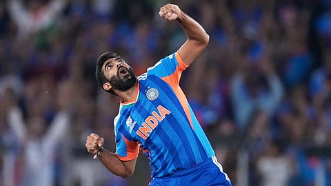 India's Jasprit Bumrah celebrates the wicket of New Zealand's Matt Henry during the T20 World Cup cricket final match between India and New Zealand in Ahmedabad.