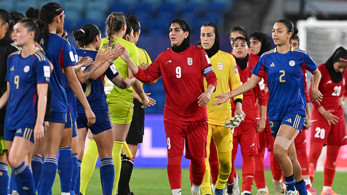 Iran's Zahra Ghanbari, center, gestures to the Philippines players following the Women's Asian Cup soccer match between Iran and the Philippines in Robina, Australia, Sunday, March 8, 2026. - | Photo: AP/DAVE HUNT