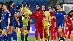 | Photo: AP/DAVE HUNT : Iran's Zahra Ghanbari, center, gestures to the Philippines players following the Women's Asian Cup soccer match between Iran and the Philippines in Robina, Australia, Sunday, March 8, 2026.