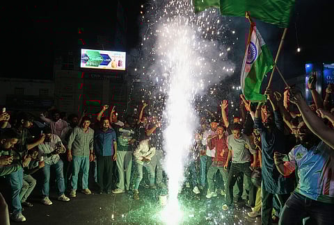 Cricket fans celebrate after India defeated New Zealand final match of T20 World Cup in Lucknow Uttar Pradesh state.