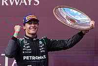 | Photo: AP/Scott Barbour : Mercedes driver George Russell of Britain celebrates after winning the Australian Formula One Grand Prix at Albert Park, in Melbourne, Australia.