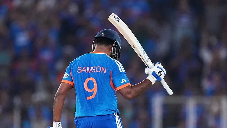 India's Sanju Samson celebrates his fifty runs during the T20 World Cup cricket final match between India and New Zealand in Ahmedabad. - | Photo: AP/Ajit Solanki