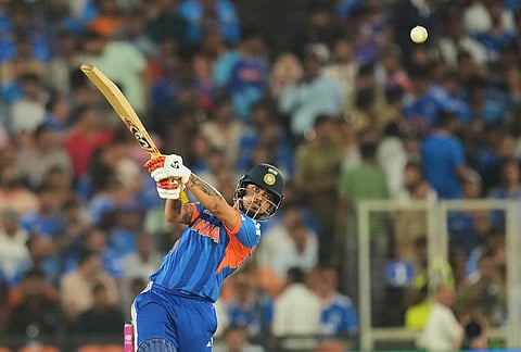 India's Ishan Kishan hits a six during the T20 World Cup cricket final match between India and New Zealand in Ahmedabad.
