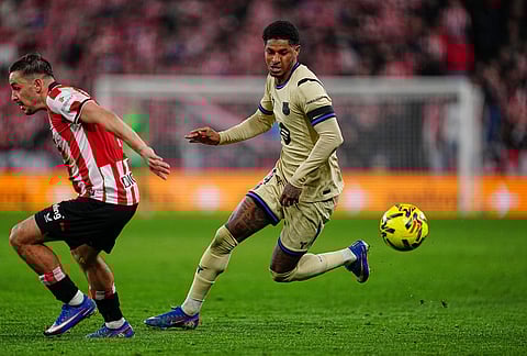 Barcelona's Marcus Rashford, right, and Athletic Bilbao's Aymeric Laporte go for the ball during the Spanish La Liga soccer match between Athletic Bilbao and Barcelona in Bilbao, Spain.