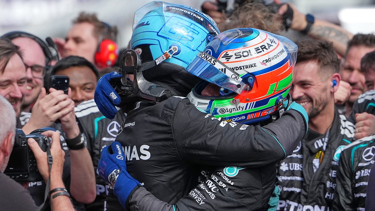 Mercedes driver George Russell, left, of Britain embraces teammate Andrea Kimi Antonelli of Italy after winning the Australian Formula One Grand Prix at Albert Park. - AP/Asanka Brendon Ratnayake