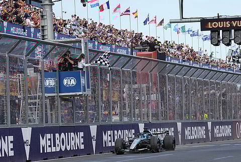 Mercedes driver George Russell of Britain crosses the finish line to win the Australian Formula One Grand Prix at Albert Park, in Melbourne, Australia.