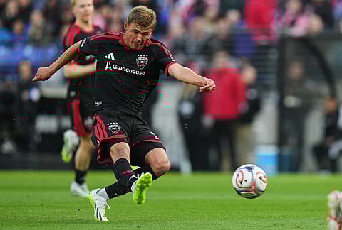 D.C. United midfielder Jackson Hopkins shoots but is unable to score against Inter Miami goalkeeper Dayne St. Clair (not shown) during the first half of an MLS soccer match, in Baltimore. 
