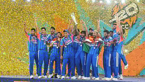 India's players celebrate with the trophy after winning the T20 World Cup final match against New Zealand, in Ahmedabad.
