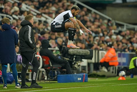 Newcastle's Joelinton gets ready to come on during the fifth round FA Cup soccer match between Newcastle and Manchester City in Newcastle, England.
