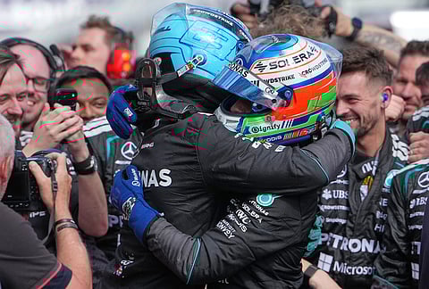 Mercedes driver George Russell, left, of Britain embraces teammate Andrea Kimi Antonelli of Italy after winning the Australian Formula One Grand Prix at Albert Park, in Melbourne, Australia.