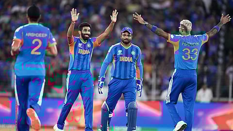 India's Jasprit Bumrah, second left, celebrates with teammates the wicket of New Zealand's captain Mitchel Santner during the T20 World Cup final in Ahmedabad.