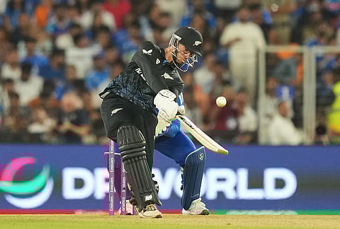 New Zealand's captain Mitchel Santner plays a shot during the T20 World Cup cricket final match between India and New Zealand in Ahmedabad.