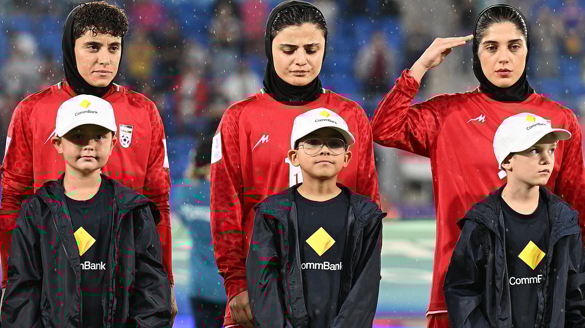 | Photo: AP/DAVE HUNT : Iran players react during their national anthem ahead of the Women's Asian Cup soccer match between Iran and the Philippines in Robina, Australia, Sunday, March 8, 2026. 